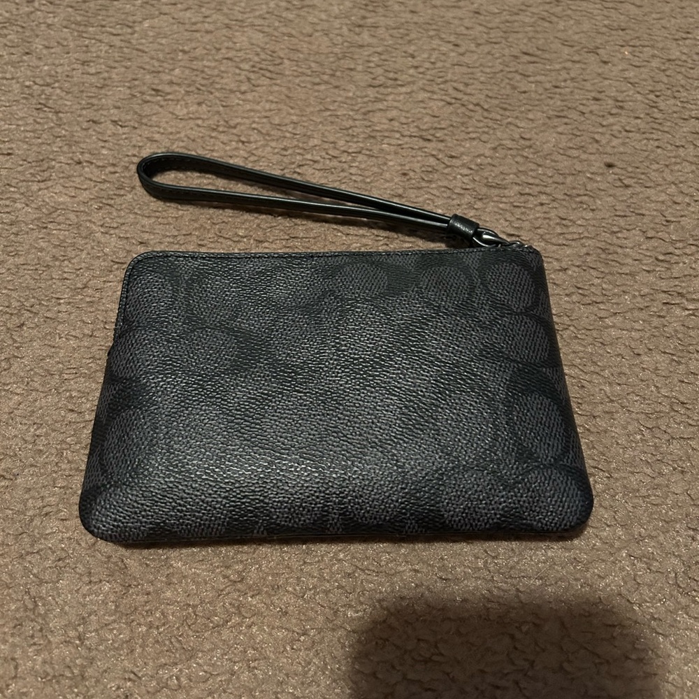 Coach Corner Zip Wristlet
In Signature Canvas - Picture 2 of 4